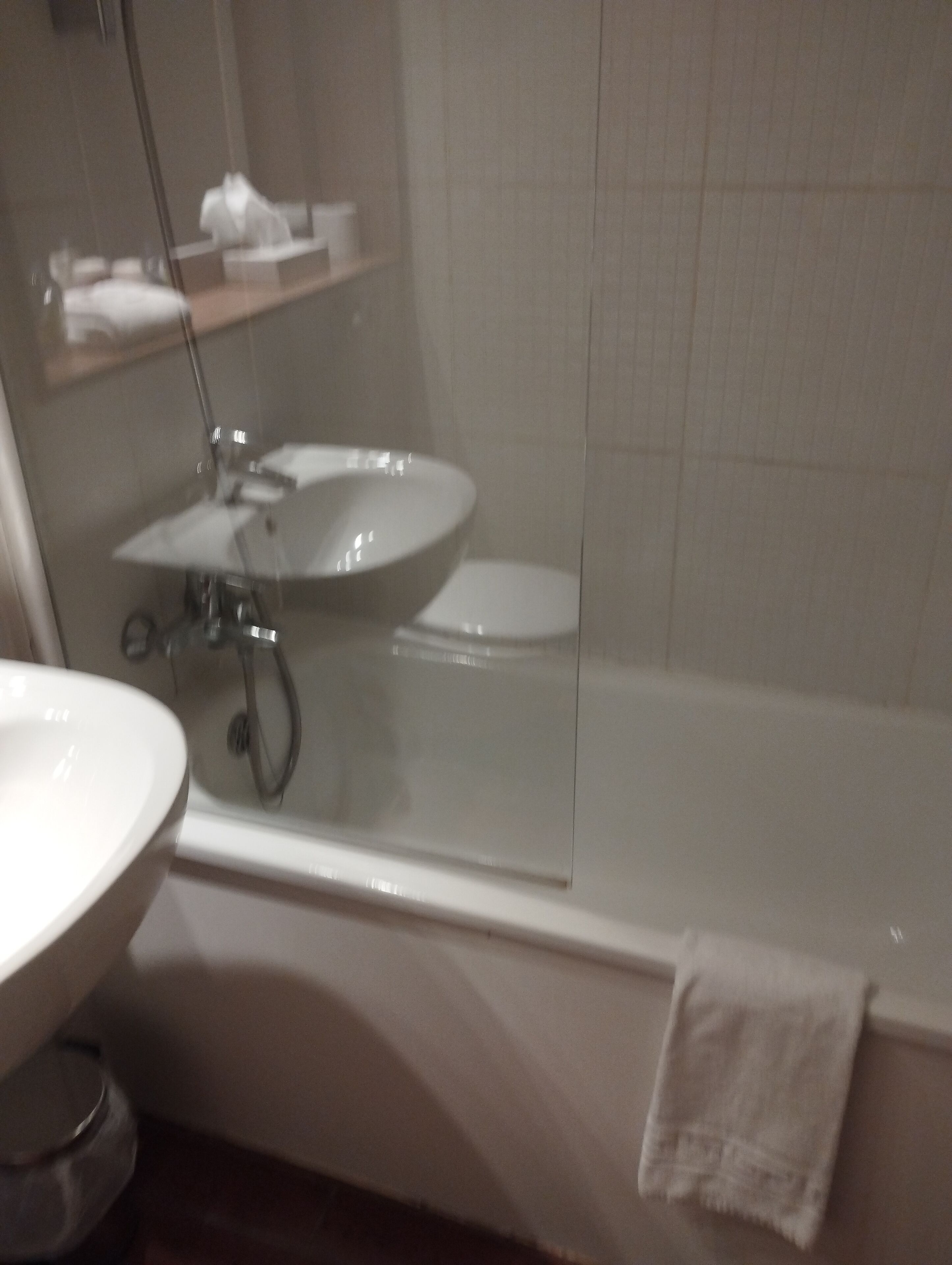 A bathroom with a sink, toilet, and bathtub.