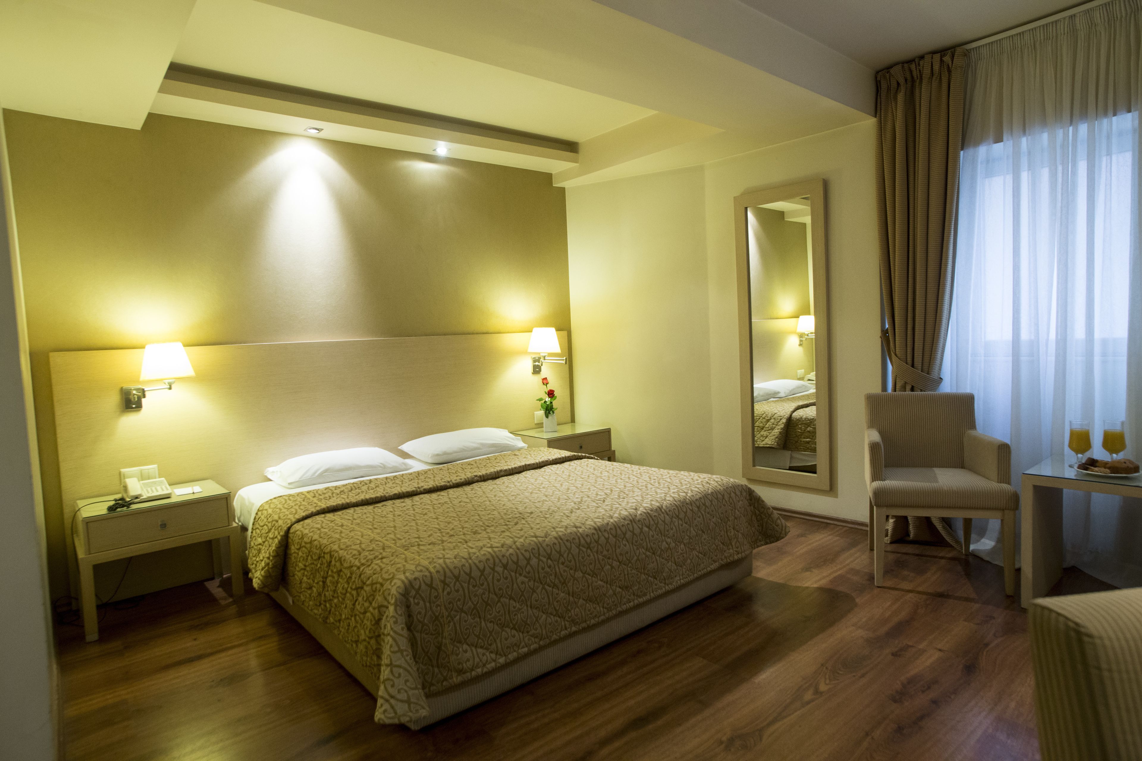 Double Room | Minibar, in-room safe, desk, blackout drapes