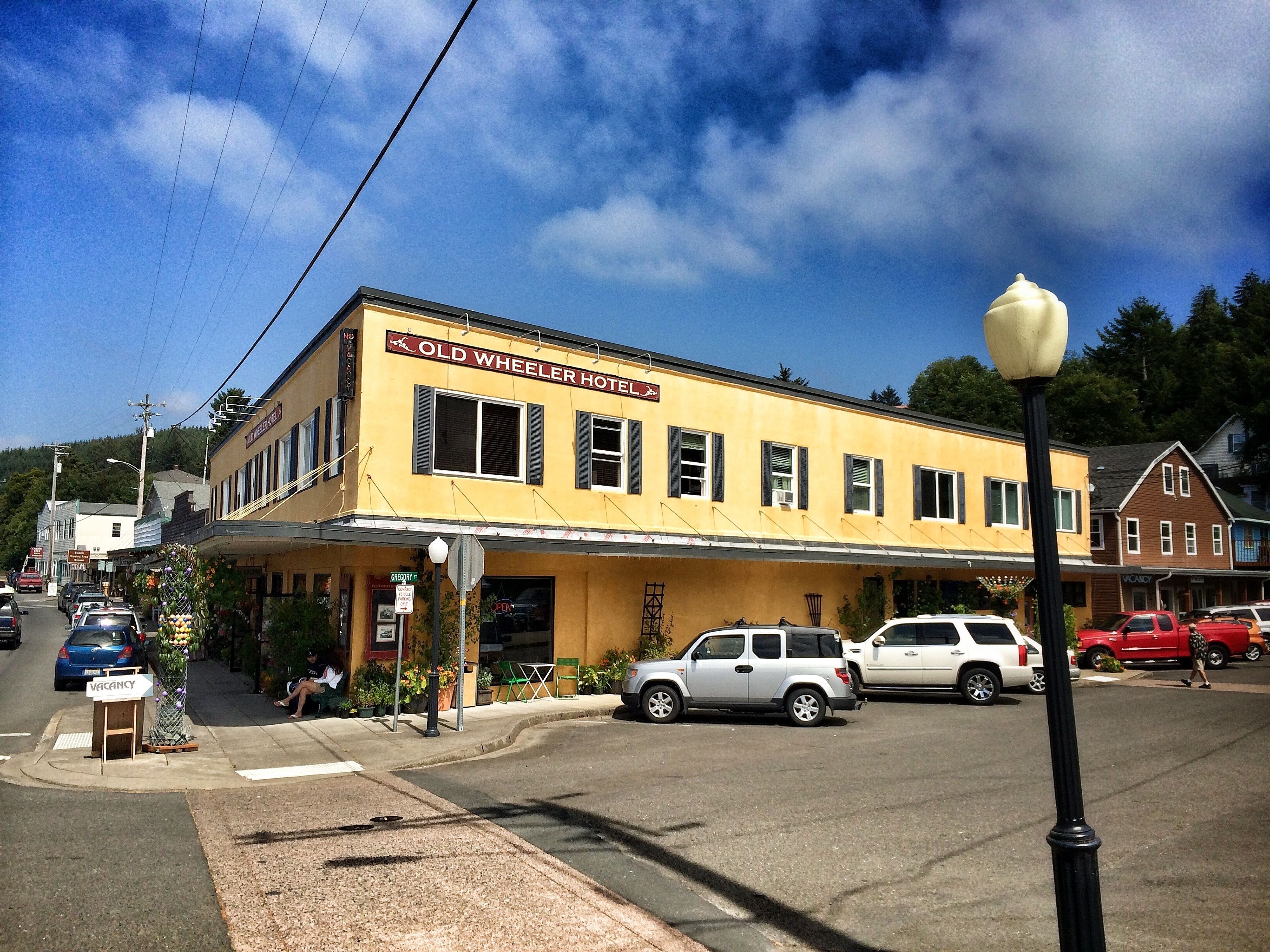 A yellow building with a sign reading "Old Wheeler Hotel".