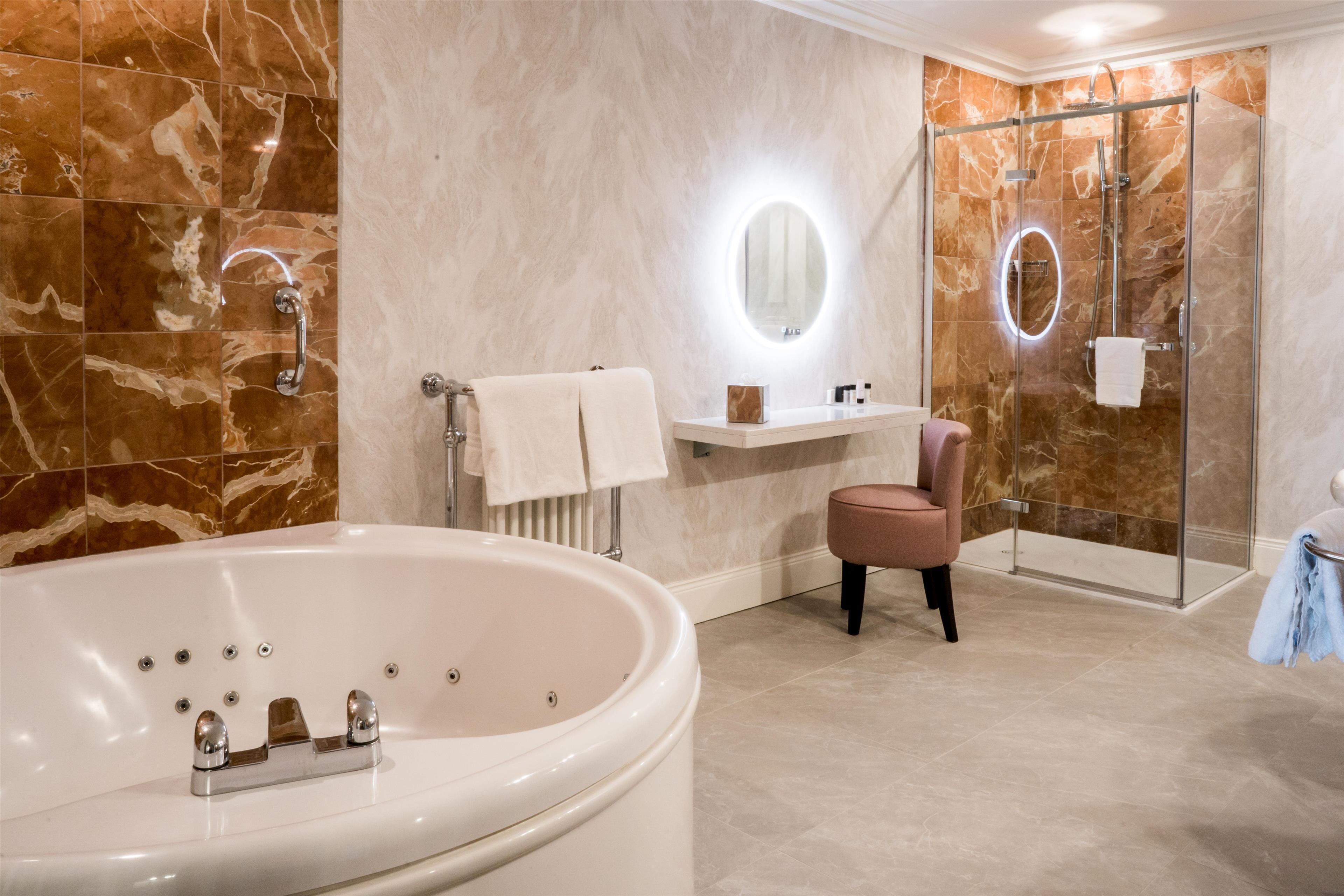 deluxe double suite  | bathroom | separate bathtub and shower, free toiletries, hair dryer, bathrobes