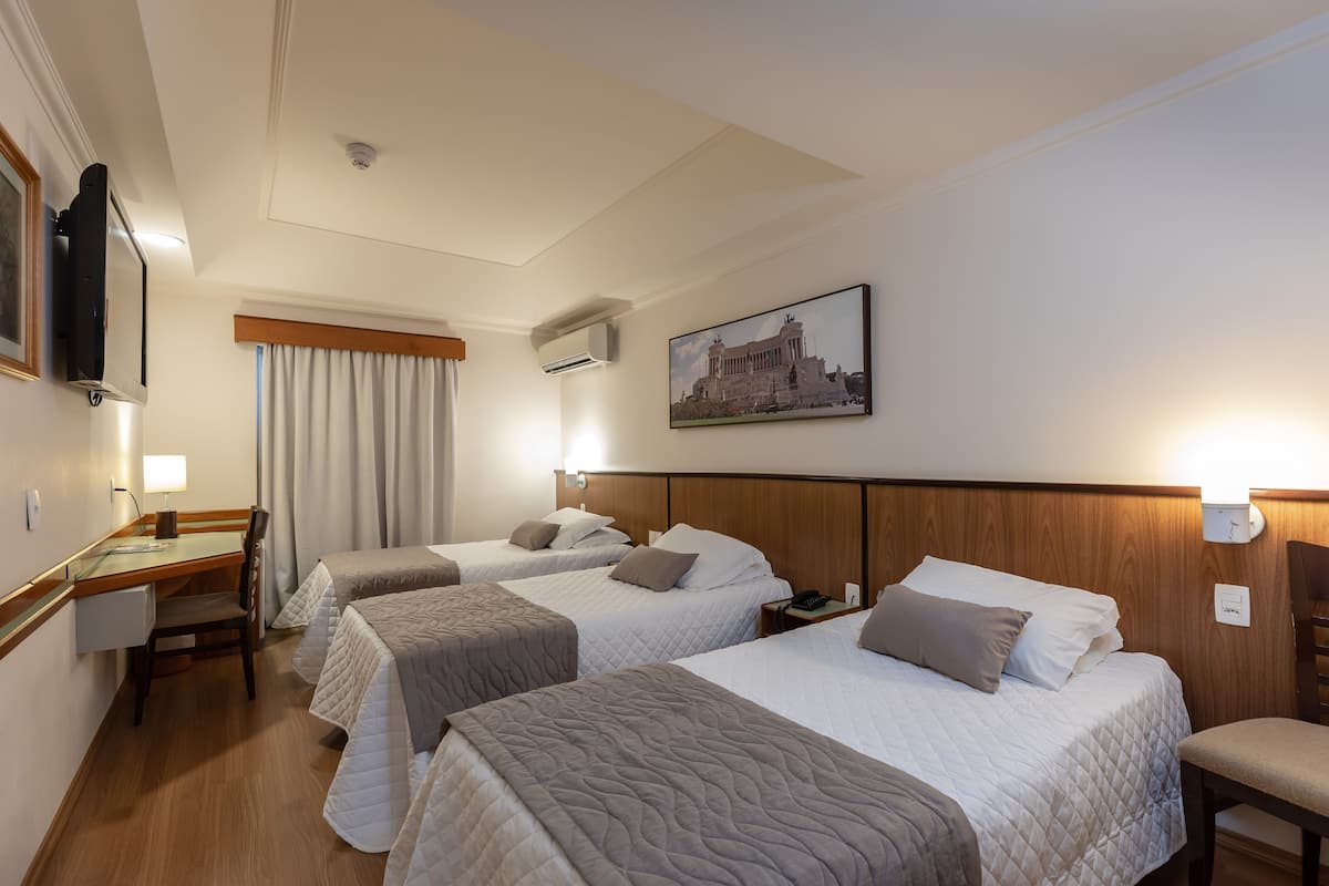 Deluxe Triple Room | 1 bedroom, minibar, in-room safe, desk