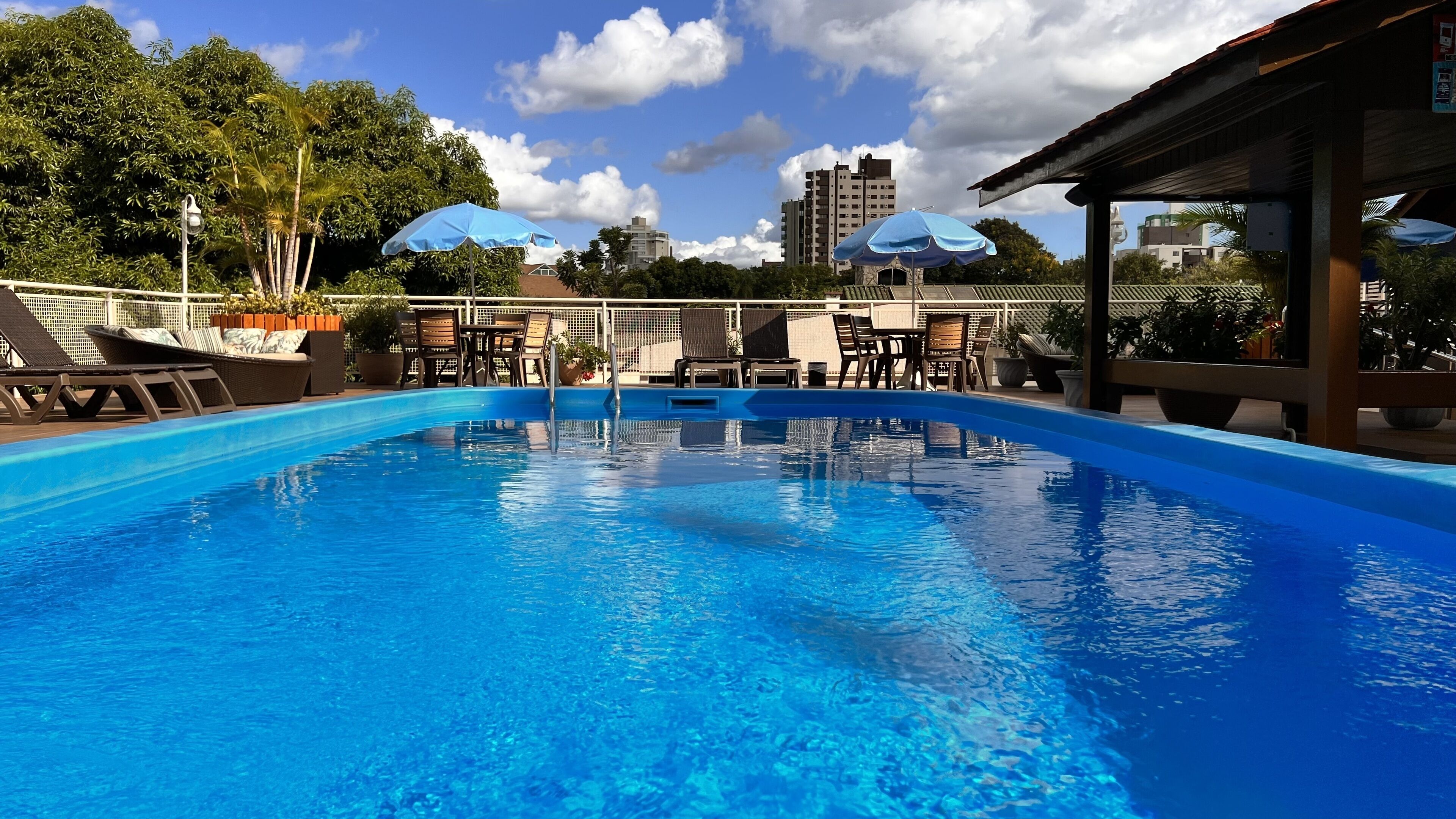 2 outdoor pools, open 8:00 am to 11:00 pm, pool umbrellas, pool loungers