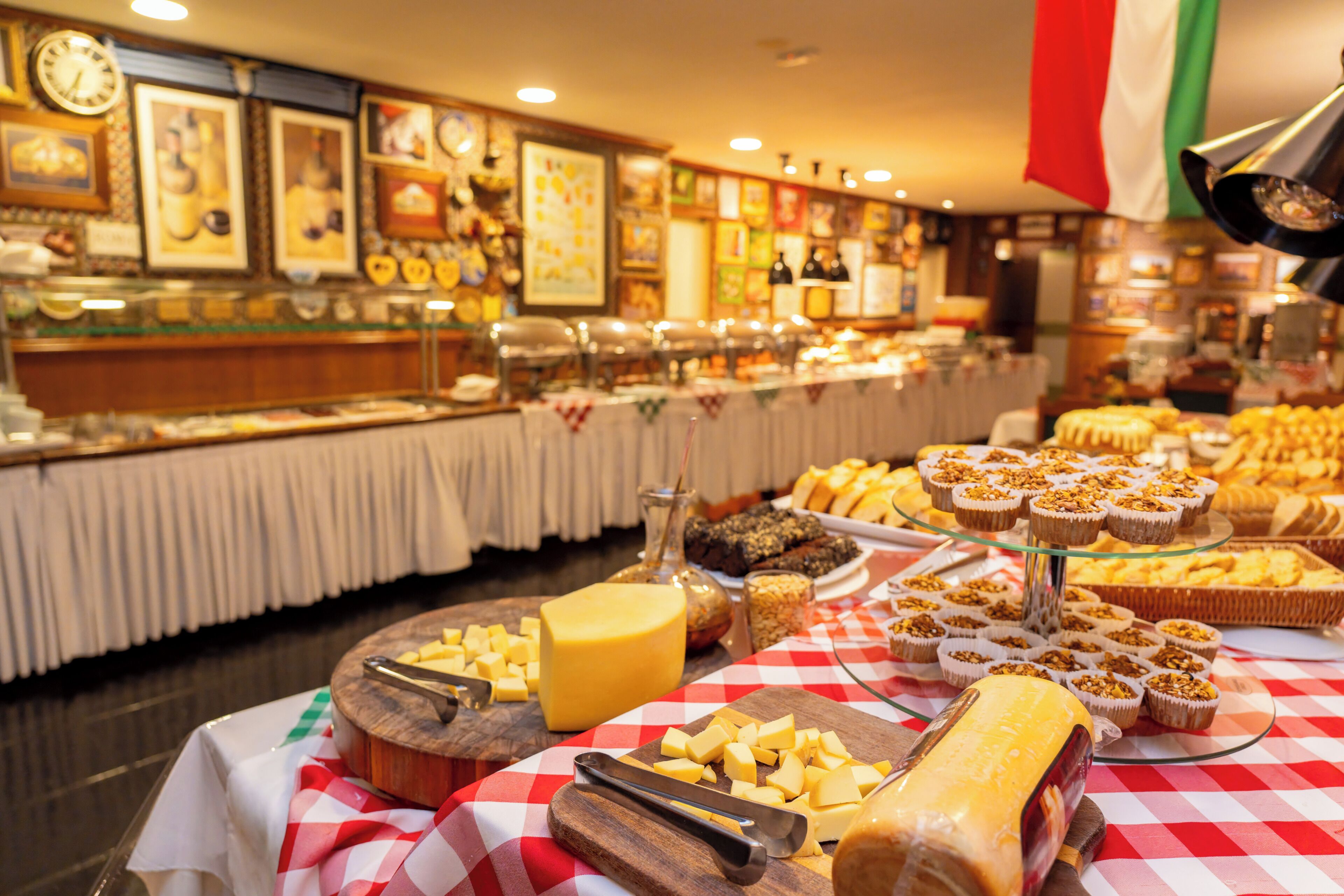 A buffet with various food items and a clock on the wall.