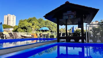2 outdoor pools, open 8:00 AM to 11:00 PM, pool umbrellas, pool loungers