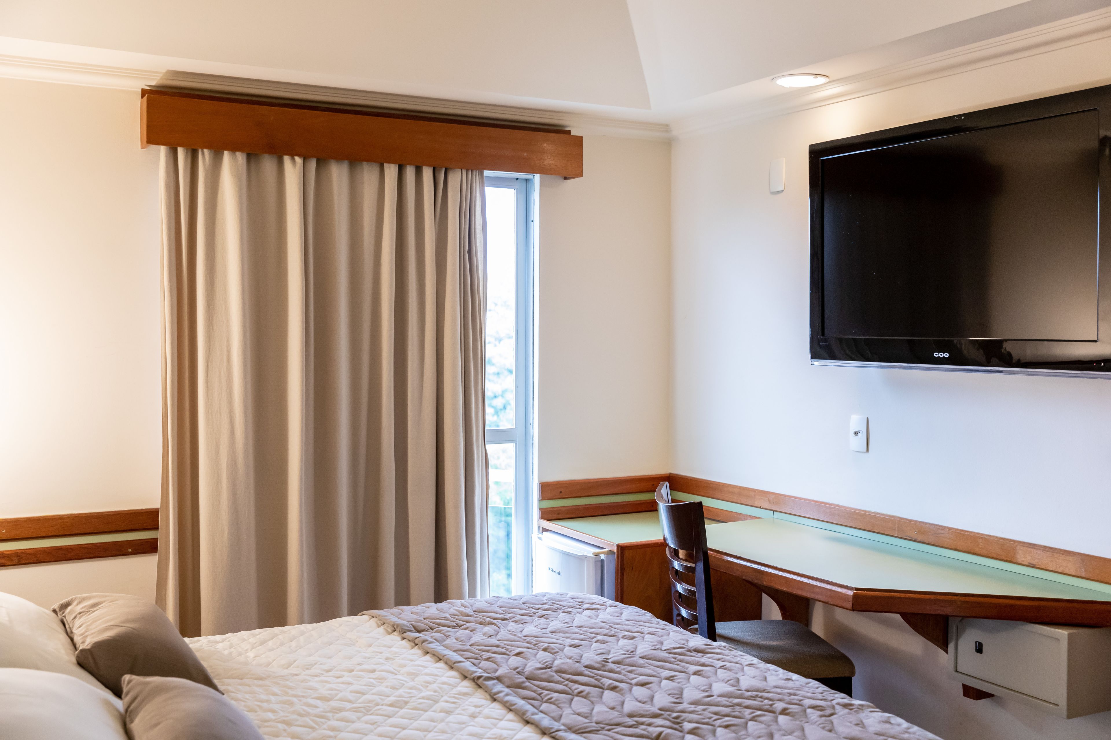 deluxe double room | minibar, in-room safe, desk, laptop workspace