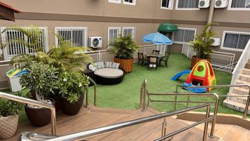 2 outdoor pools, open 8:00 AM to 11:00 PM, pool umbrellas, pool loungers