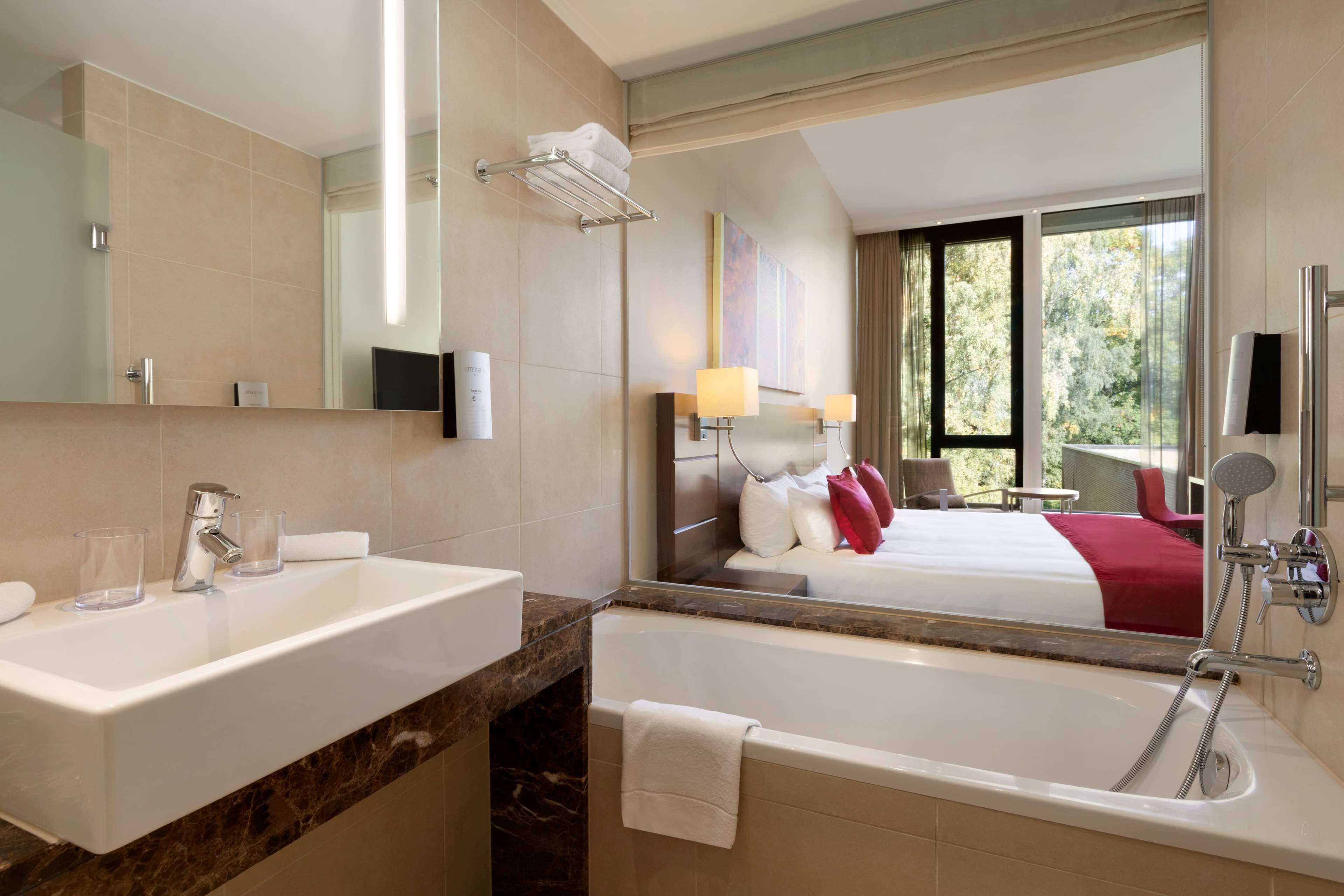 deluxe room | bathroom | eco-friendly toiletries, hair dryer, bathrobes, slippers