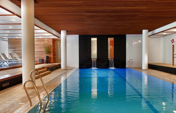Indoor pool, open 6:00 AM to 11:00 PM, pool loungers