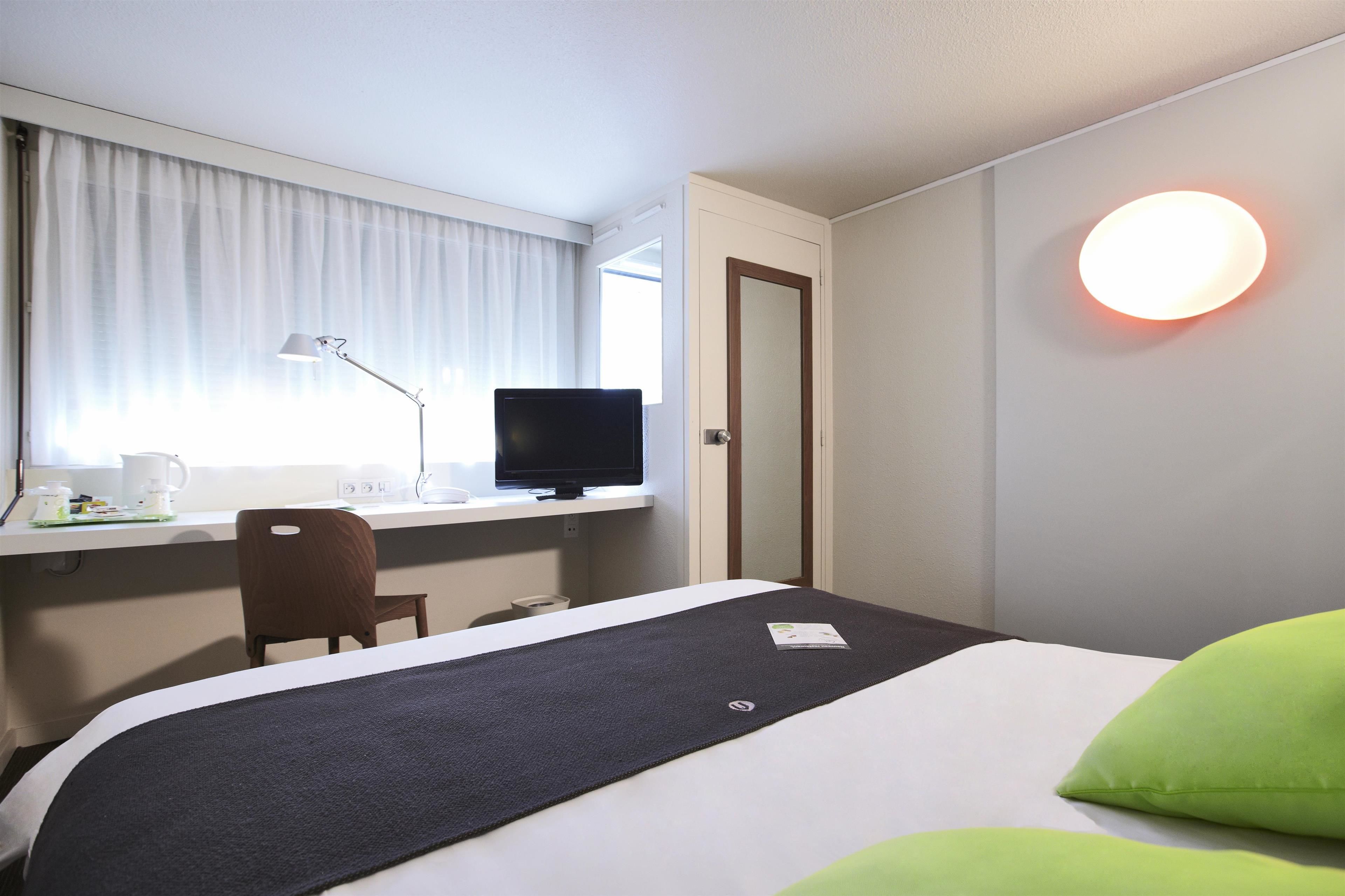 Premium bedding, desk, blackout drapes, soundproofing