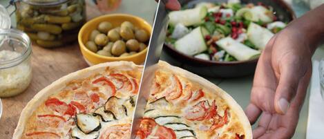 A pizza being cut with a knife.