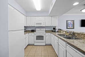 Oceanfront Deluxe Two Bedroom Condo | Private kitchen | Microwave, coffee/tea maker