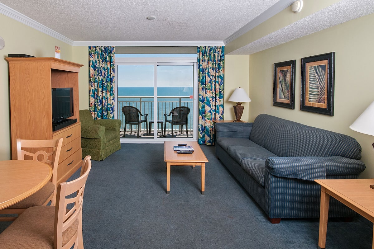 Oceanfront Deluxe One Bedroom Condo | Living area | TV