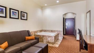 Desk, laptop workspace, iron/ironing board, free cribs/infant beds