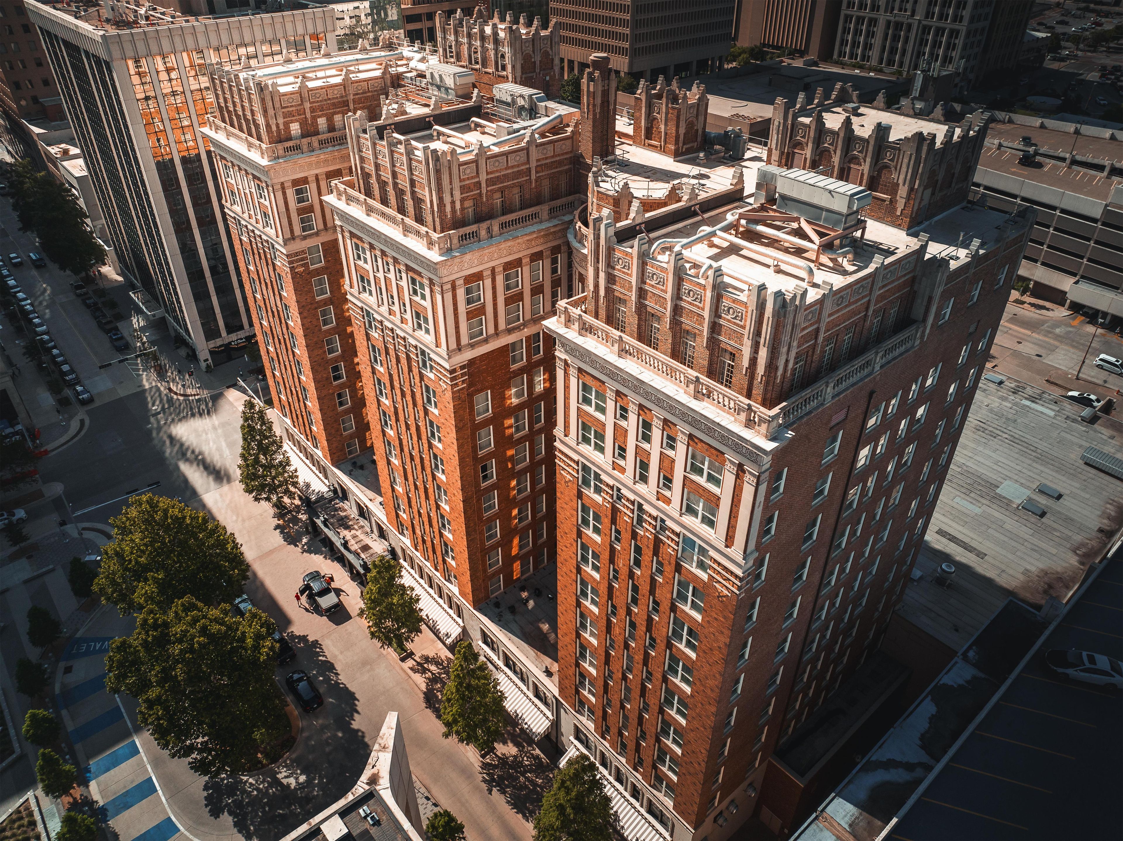 A high-rise building with a classic architectural style, featuring multiple stories and a prominent corner entrance.