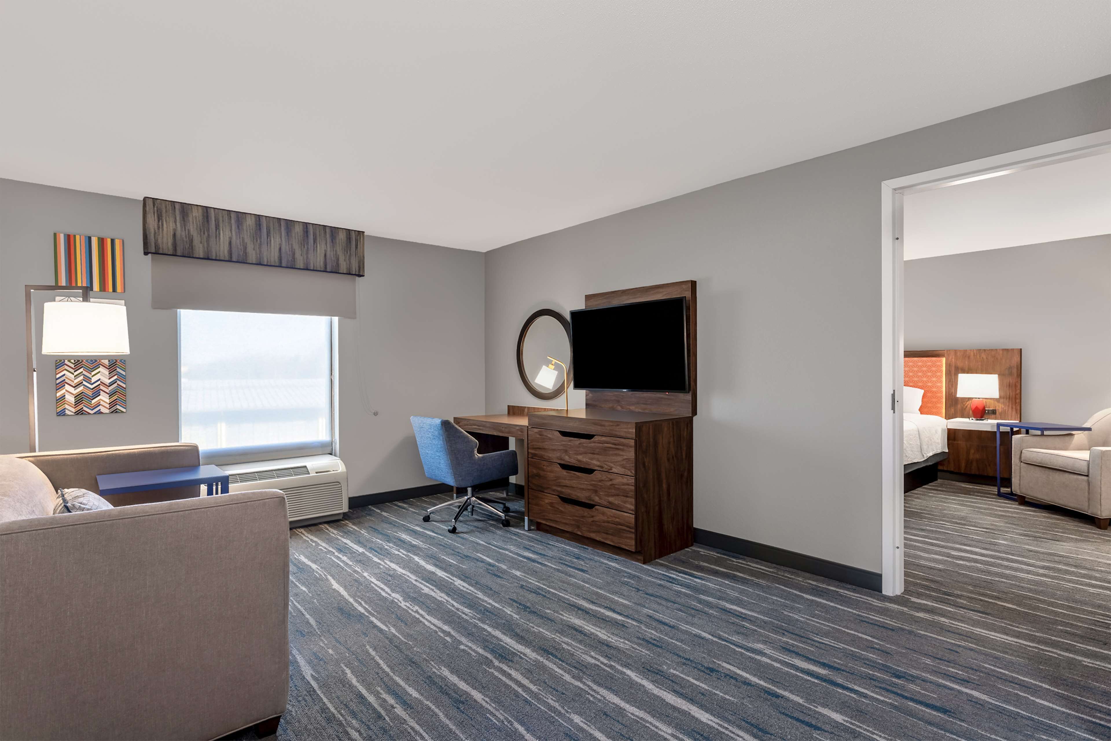 two room king suite lr one bath | desk, laptop workspace, blackout curtains, iron/ironing board