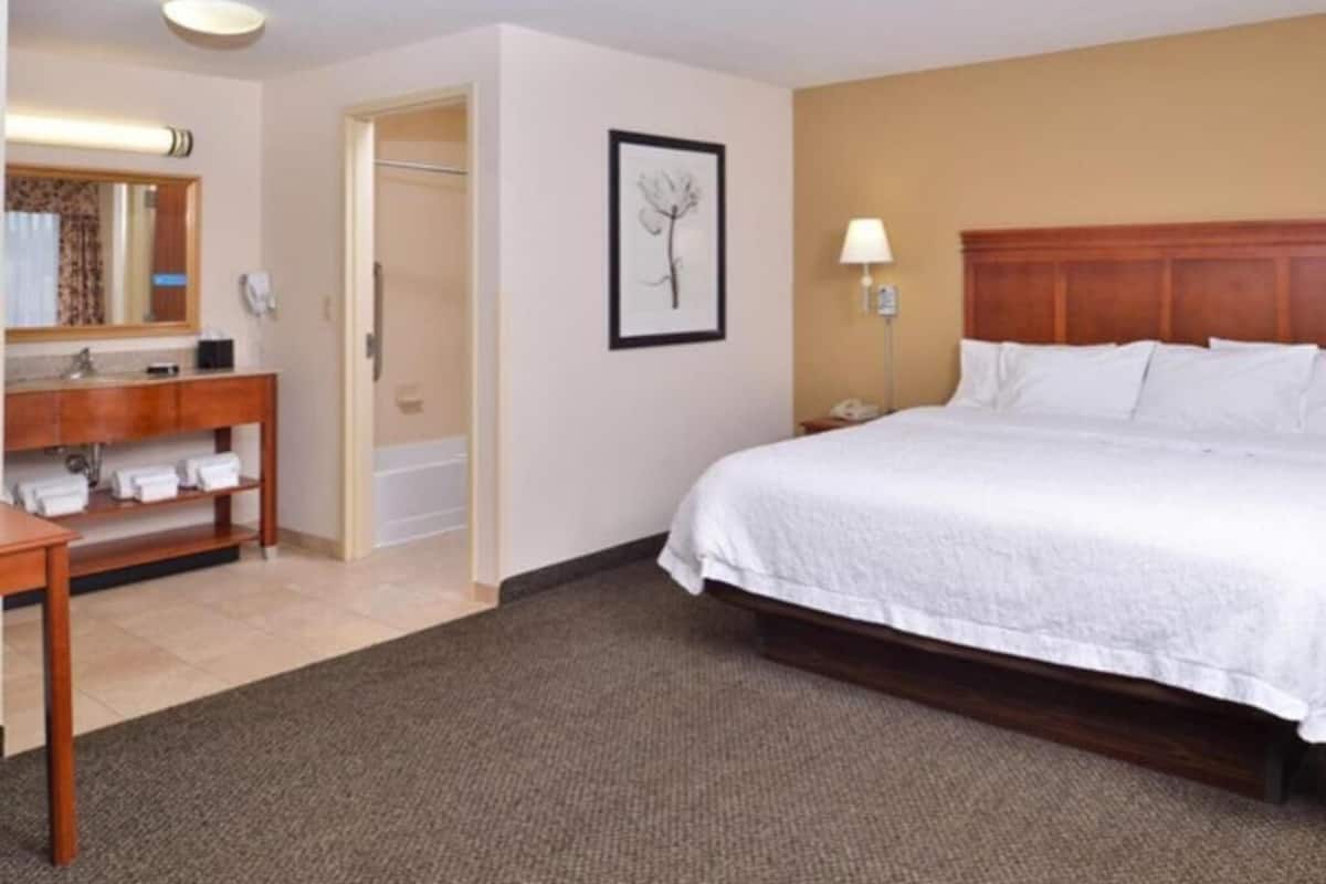Desk, laptop workspace, blackout curtains, iron/ironing board