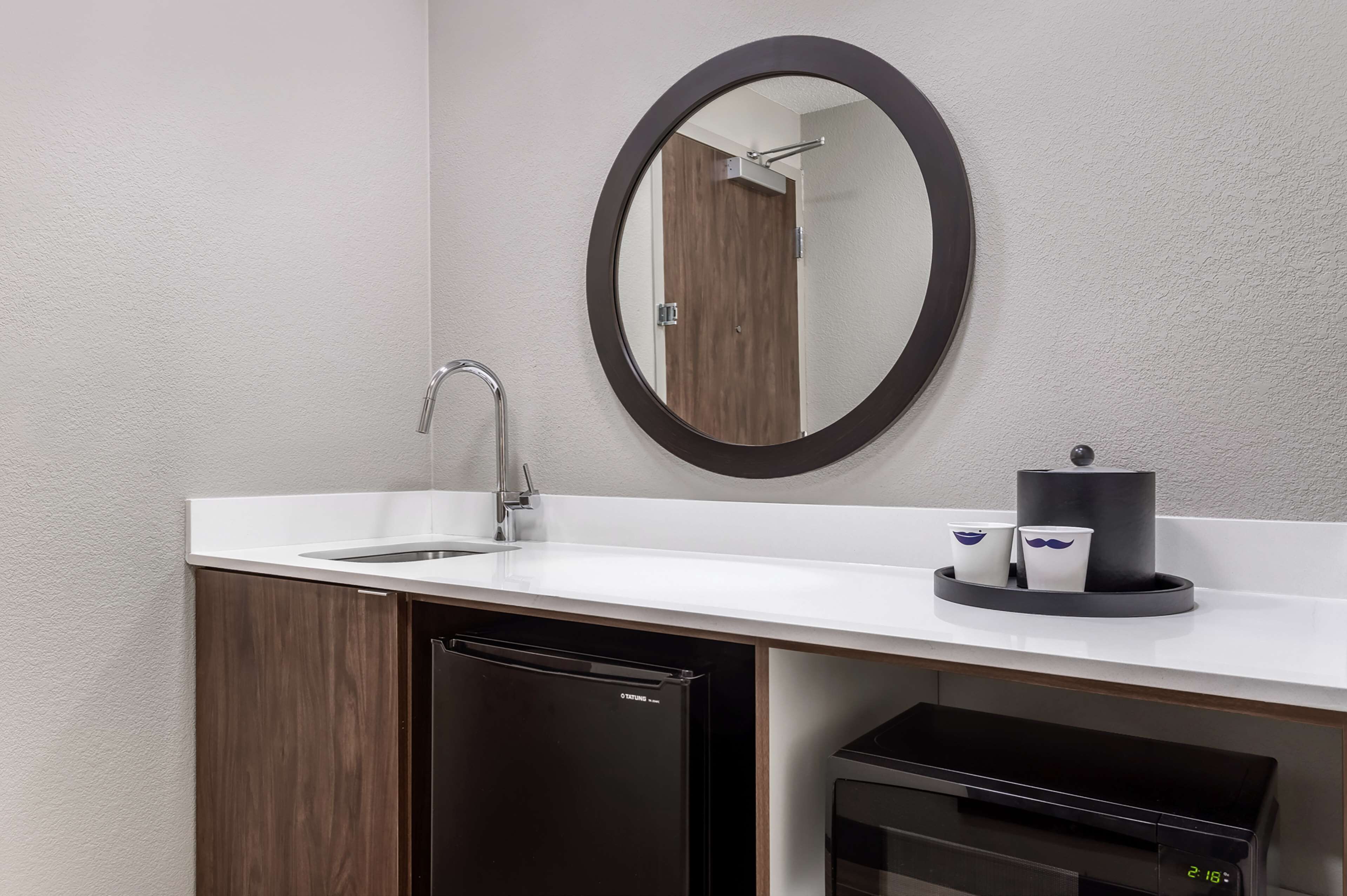 desk, laptop workspace, blackout curtains, iron/ironing board