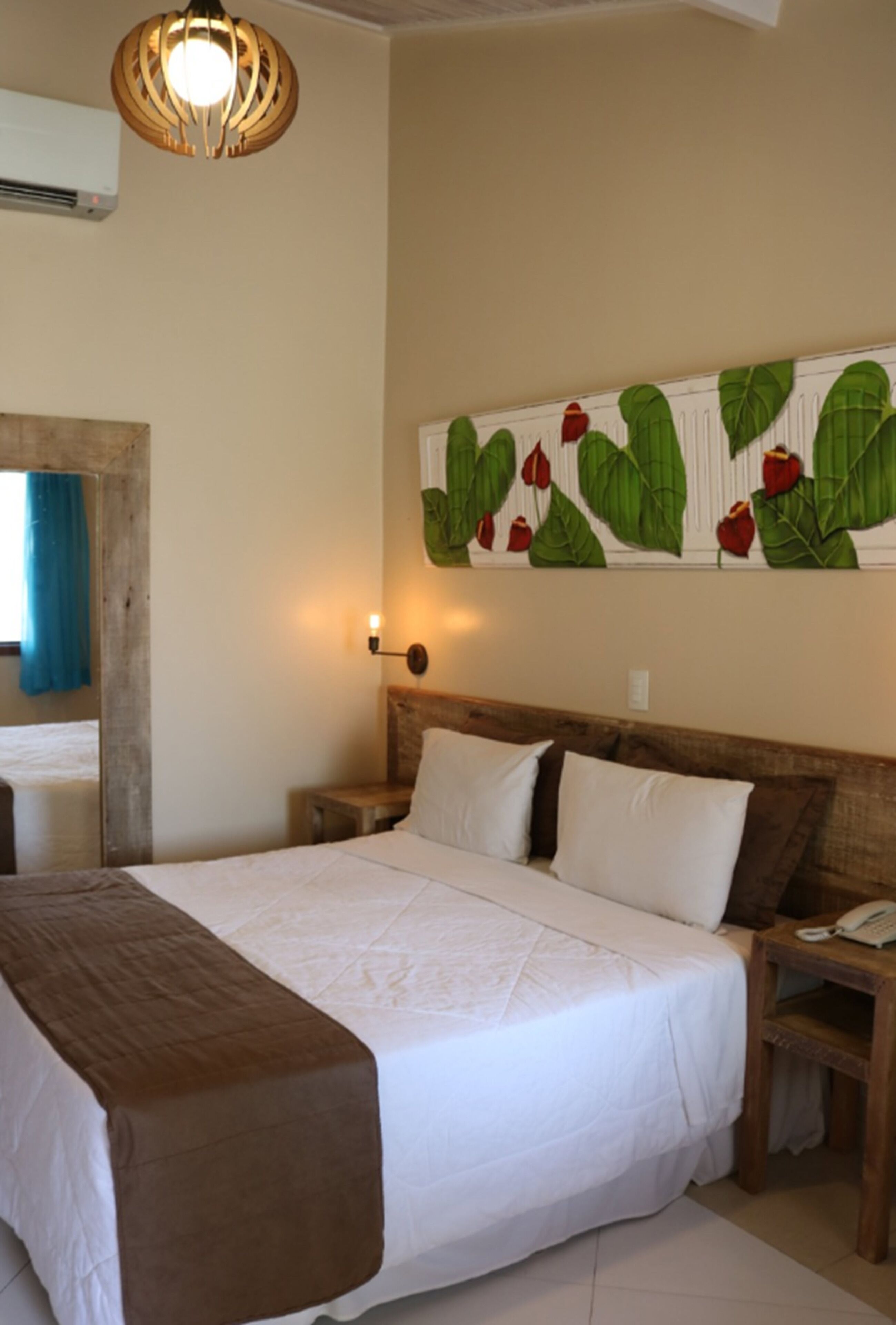 Standard Room | Minibar, in-room safe, individually decorated, blackout drapes