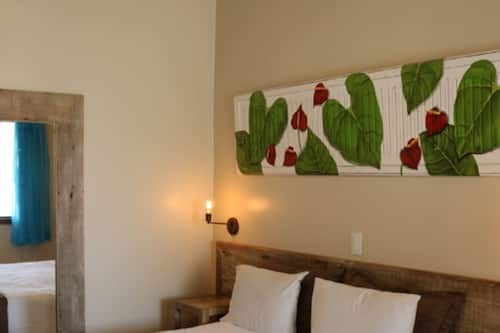 Standard Room | Minibar, in-room safe, individually decorated, blackout drapes