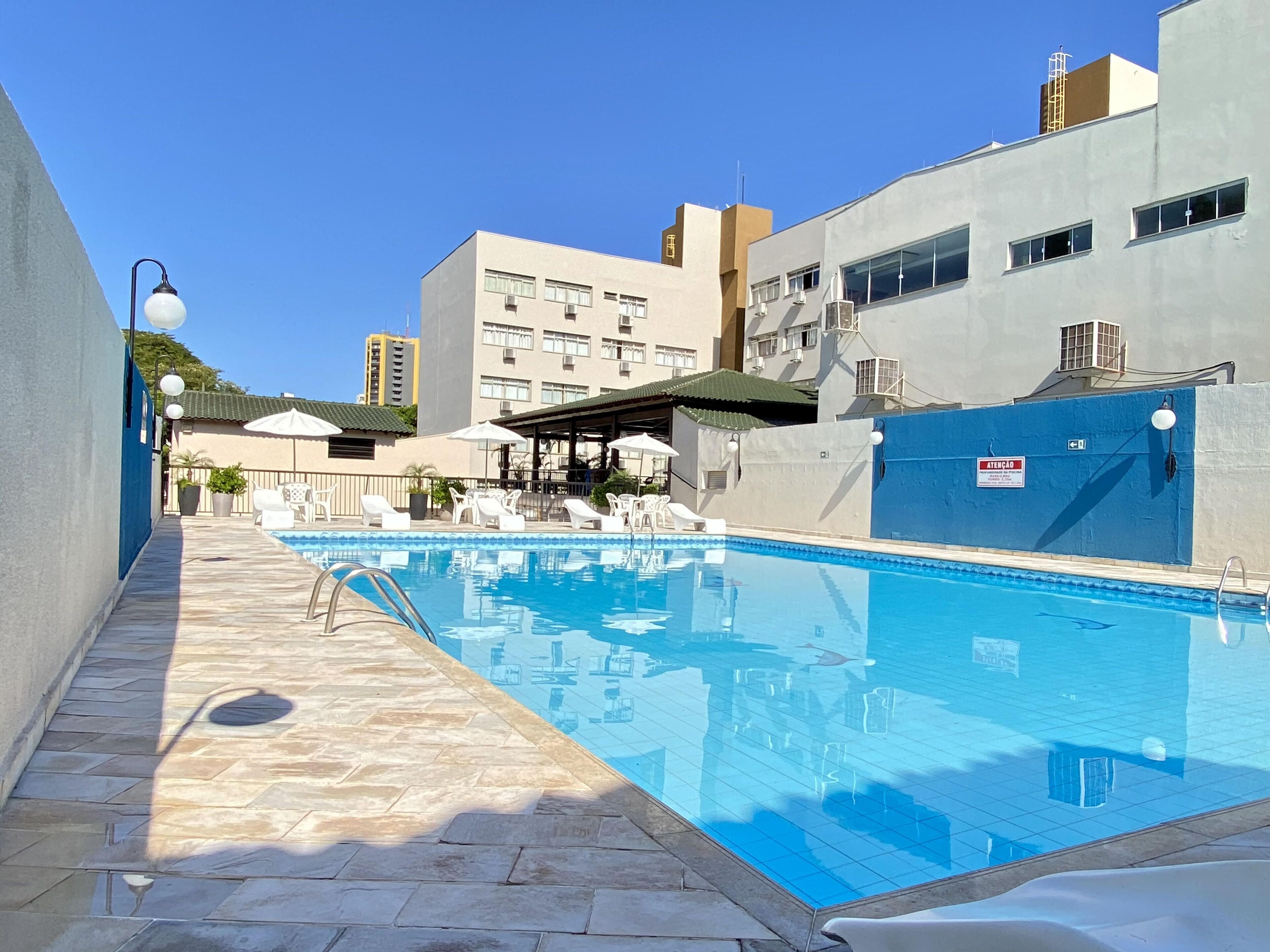 outdoor pool, pool umbrellas, pool loungers