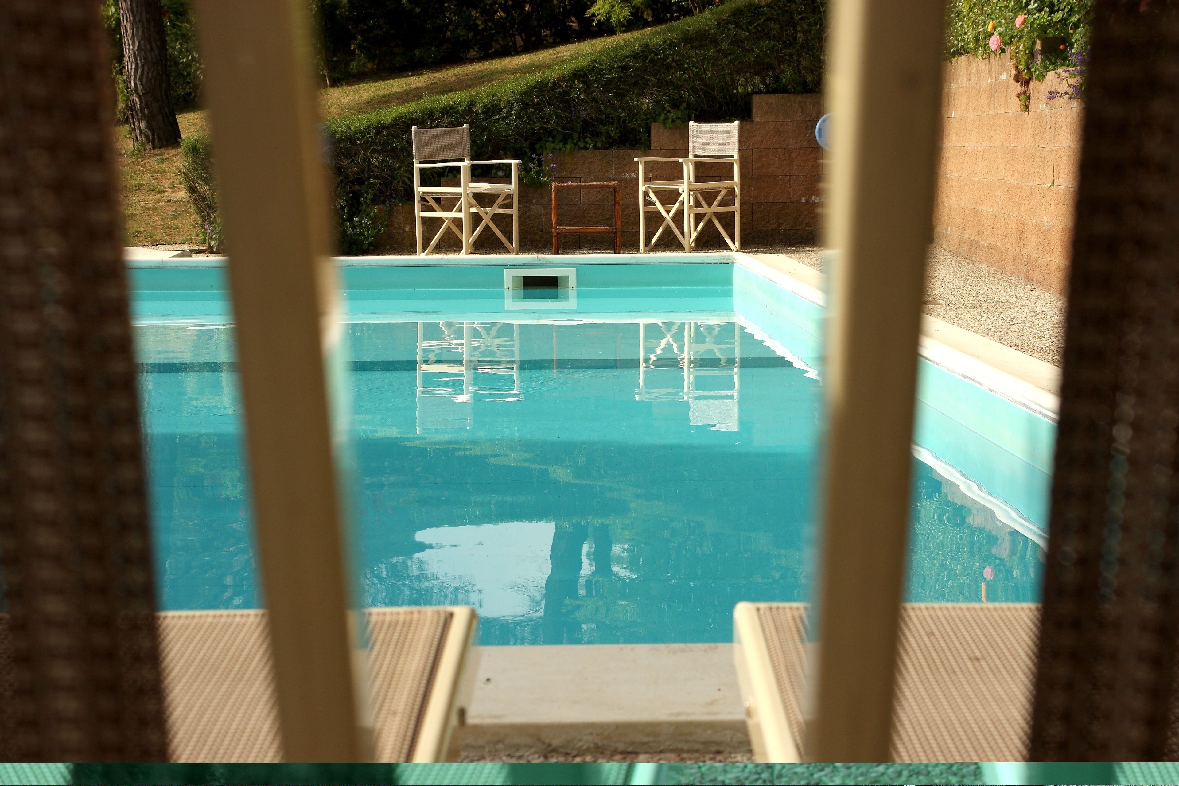 outdoor pool, open 9:30 am to 9:30 pm, pool umbrellas, pool loungers