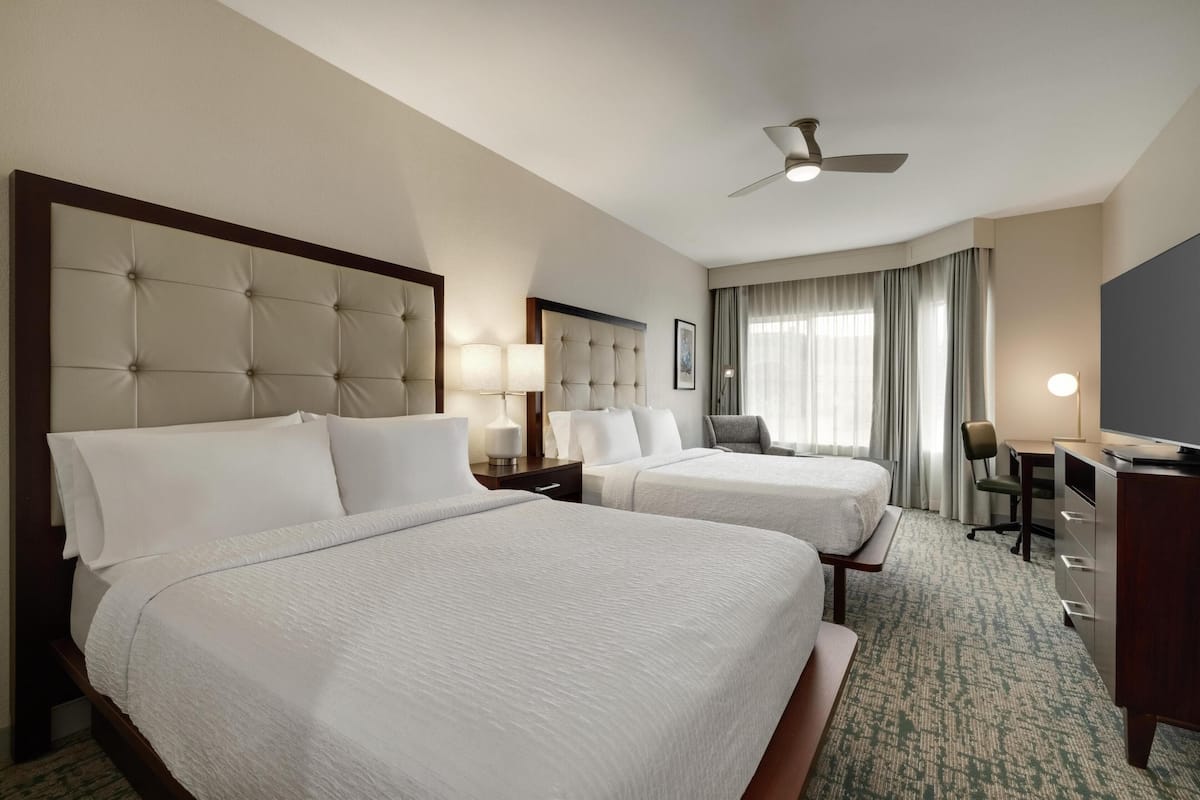 Suite, 2 Queen Beds | In-room safe, iron/ironing board, free cots/infant beds, free WiFi