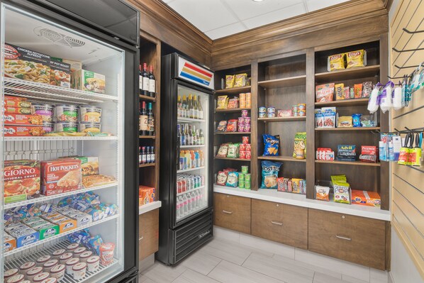 A grocery store with a refrigerated section, shelves stocked with snacks, and a variety of beverages. - Holiday Inn Express Hotel Sacramento Airport Natomas by IHG (Sacramento)
