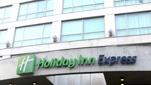 A Holiday Inn Express building with a modern facade, large windows, and a prominent entrance. - Holiday Inn Express Mexico Reforma by IHG (Mexico City)