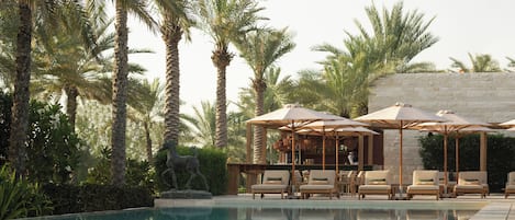 Outdoor pool, pool umbrellas, sun loungers