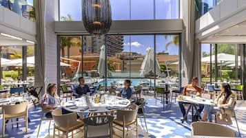 Breakfast, lunch, dinner served; Mediterranean cuisine, pool views