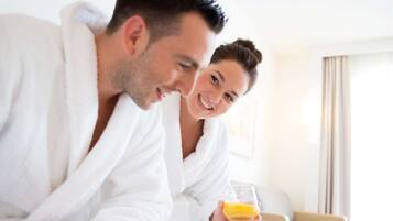 Relax in a serene space with a comfortable seating area, perfect for unwinding with a beverage and staying entertained.