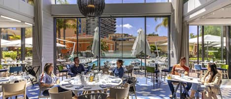 Breakfast, lunch, dinner served; Mediterranean cuisine, pool views