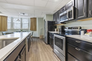 Family Suite, Multiple Beds | Private kitchen