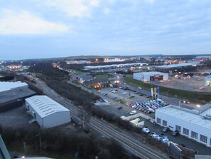 A large industrial area with multiple buildings, a parking lot, and railway tracks. - Holiday Inn Birmingham North - Cannock by IHG (Cannock)