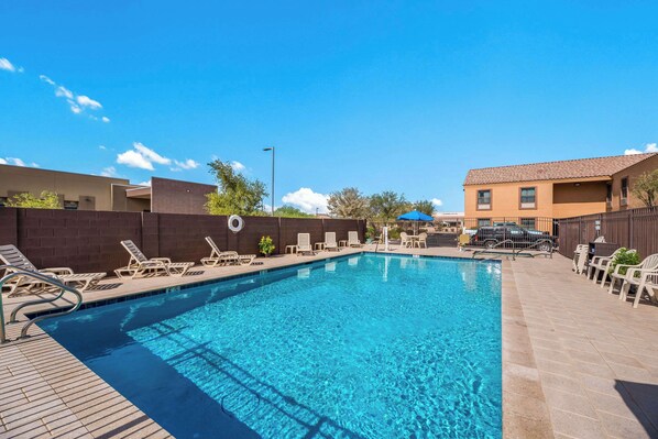 Outdoor pool, open 9:00 AM to 9:00 PM, pool umbrellas, pool loungers