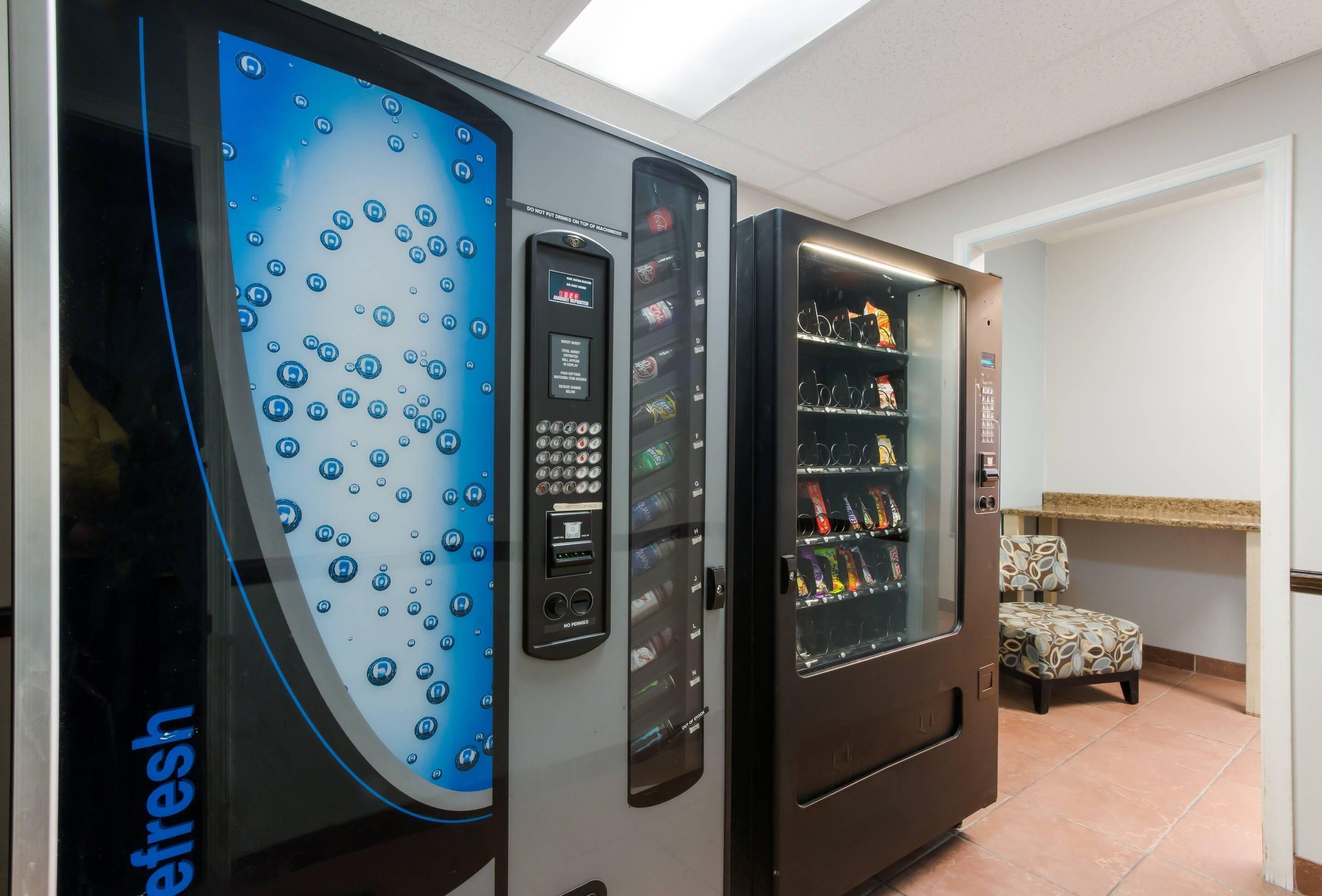 A vending machine with a digital display and a selection of snacks.