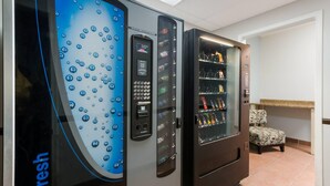 A vending machine with a digital display and a selection of snacks. - MainStay Suites Extended Stay Hotel Casa Grande (Casa Grande)
