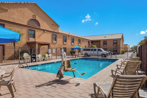 Outdoor pool, open 9:00 AM to 9:00 PM, pool umbrellas, pool loungers