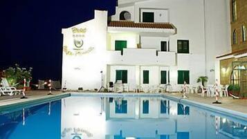 Seasonal outdoor pool, pool umbrellas, pool loungers