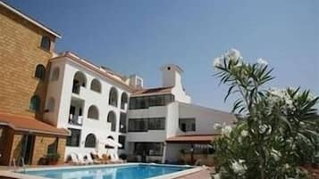 Seasonal outdoor pool, pool umbrellas, pool loungers