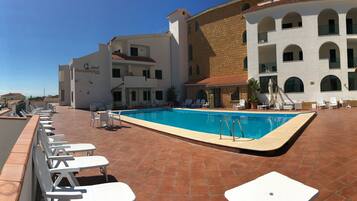 Seasonal outdoor pool, pool umbrellas, pool loungers