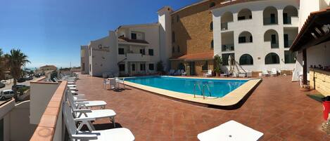 Seasonal outdoor pool, pool umbrellas, pool loungers