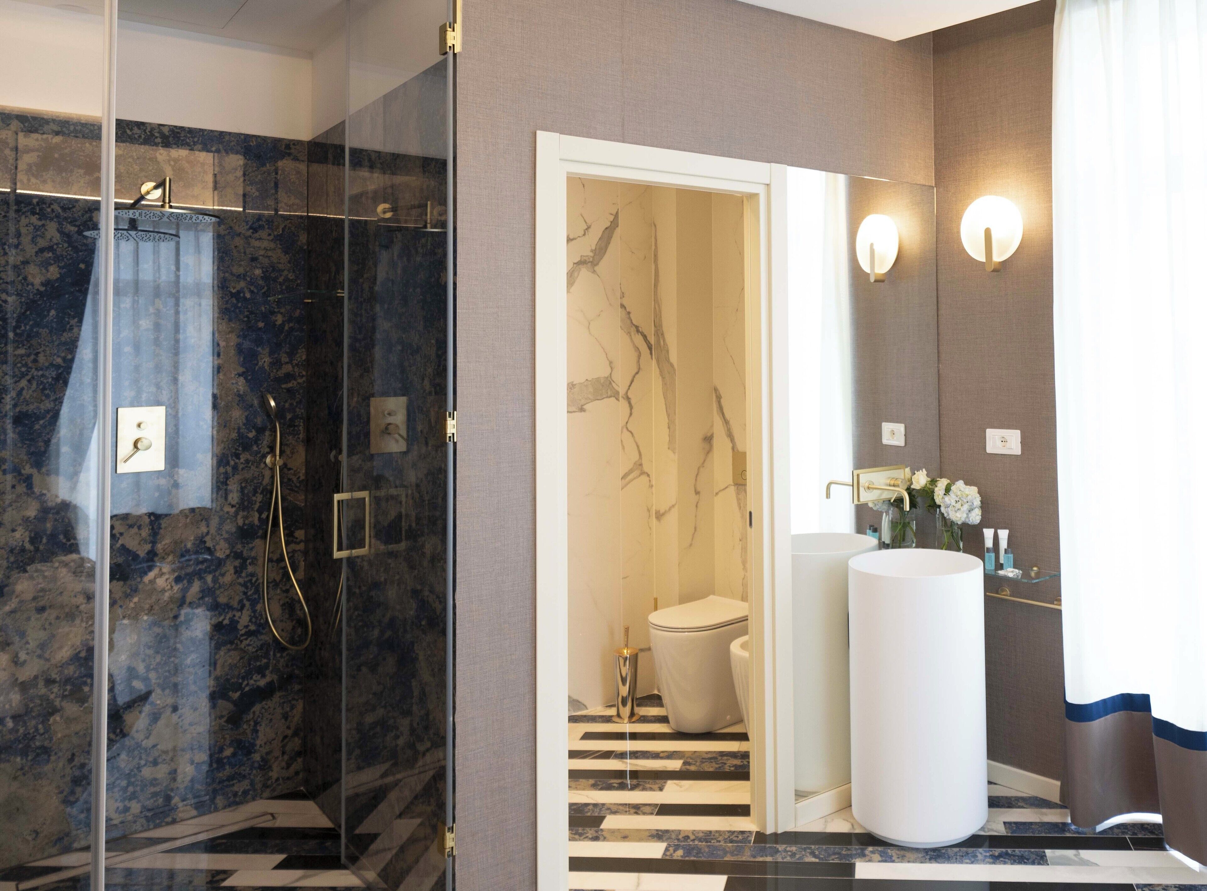 junior suite | bathroom | shower, free toiletries, hair dryer, bidet