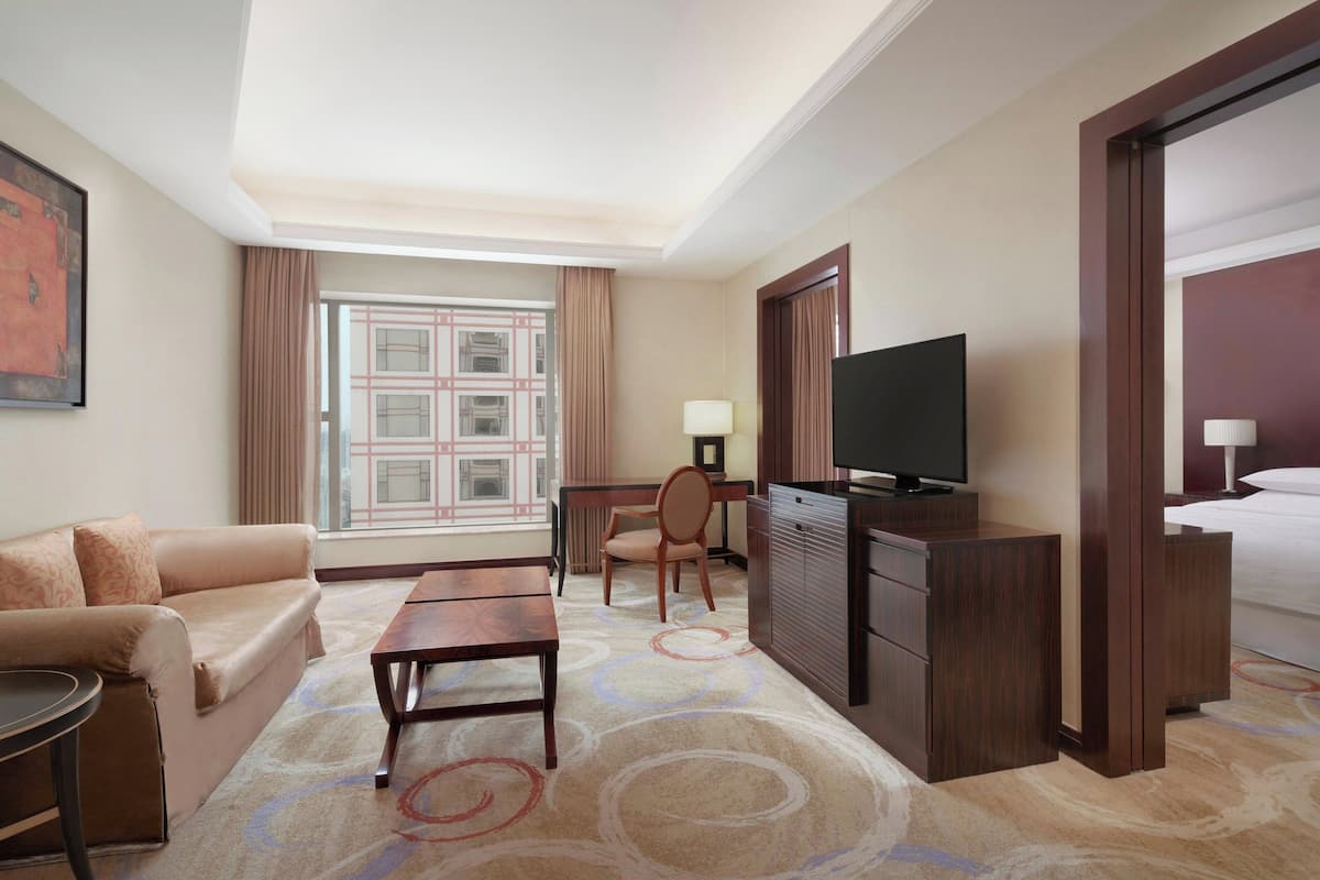 Superior Suite, 1 King Bed | Living room | 32-inch LCD TV with satellite channels, TV