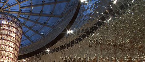 A large indoor space with a high ceiling and a glass dome structure.