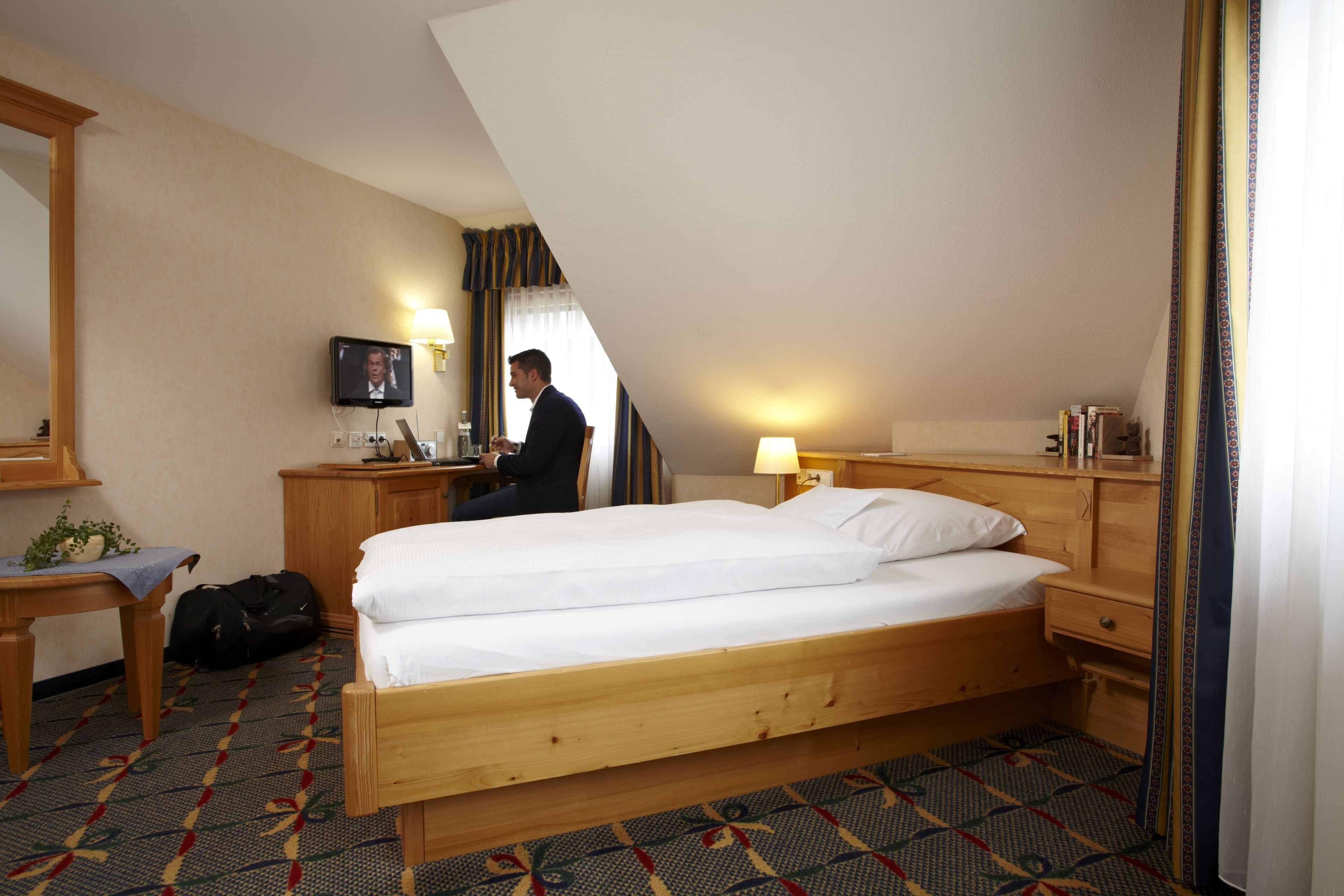 Hypo-allergenic bedding, down duvets, in-room safe
