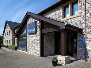 A stone building with a sign reading 'Travelodge.' - Travelodge Kendal (Kendal)
