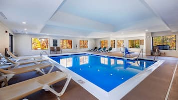 Indoor pool, open 10:00 AM to midnight, pool loungers