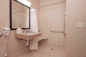 Room, 1 King Bed (Mobility/Hearing Access, Roll-In Shwr) | Bathroom | Combined shower/bathtub, designer toiletries, hair dryer, towels
