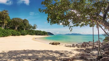 On the beach, sun-loungers, beach umbrellas, beach towels